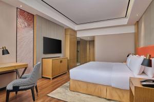 TV a/nebo společenská místnost v ubytování Hilton Garden Inn Wuhan Hankou