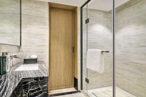 Postel nebo postele na pokoji v ubytování Hilton Garden Inn Wuhan Hankou