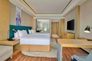 TV a/nebo společenská místnost v ubytování Hilton Garden Inn Wuhan Hankou