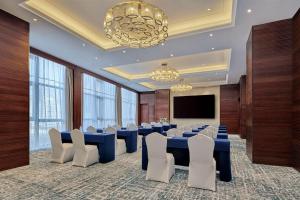 TV a/nebo společenská místnost v ubytování Hilton Garden Inn Wuhan Hankou