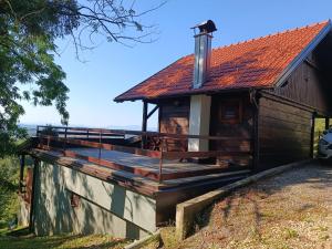 a house with a deck on the side of it at Tessina kuća in Stubicke Toplice