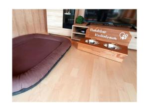 a brown bean bag bed sitting on a wooden floor at Holiday home coastal dream in Schönhagen