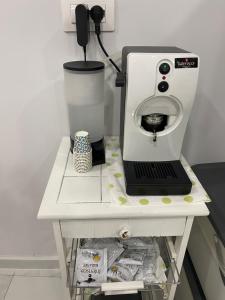 a white counter with a coffee maker on it at Isla Home in Naples +21 photos