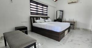 Ένα ή περισσότερα κρεβάτια σε δωμάτιο στο NK RESORT