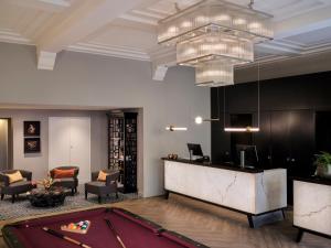 a lobby with a pool table and a bar at Park Centraal Den Haag, part of Sircle Collection in The Hague +46 photos