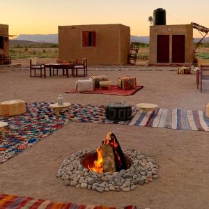a fire pit in the middle of a desert at Rimal tata camp 