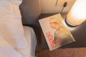 Letto o letti in una camera di Torno Design Apartment by Rent All Como