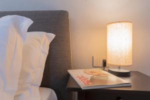 Letto o letti in una camera di Torno Design Apartment by Rent All Como
