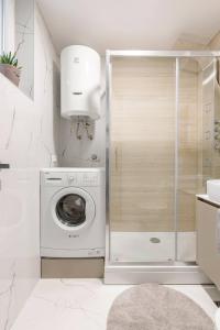 a laundry room with a washer and dryer in it at Lux Apartment Anemar in Mostar