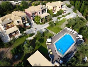 an aerial view of a house with a swimming pool at Alkyon Villas in Syvota
