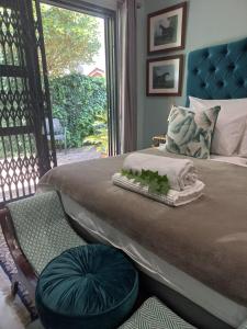 a bedroom with a large bed with a window at Lucano 1 Stellenbosch in Stellenbosch +16 photos