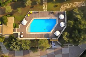 an overhead view of a swimming pool on a wooden deck at Alkyon Villas in Syvota