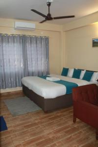 Postelja oz. postelje v sobi nastanitve Hotel Yatri