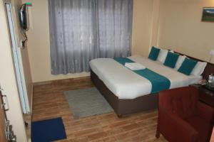 Postelja oz. postelje v sobi nastanitve Hotel Yatri