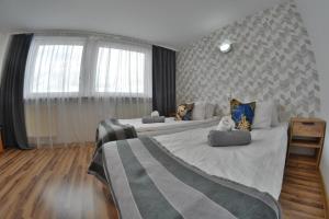 a bedroom with two large beds in a room at Noclegi Bytom - OPAL in Bytom