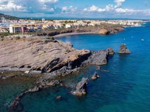 an aerial view of the ocean with rocks in the water at Appartement Cap d'Agde, 3 pièces, 4 personnes - FR-1-749-9 in Cap d'Agde