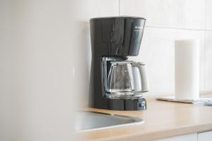 a coffee maker sitting on top of a counter at MONTEURWOHNUNG Ebersbach EB03 RAUMSCHMIDE Apartments in Ebersbach an der Fils