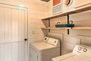 a white utility room with a washer and dryer at The Brown at Fish Tales Lodge in Mountain View