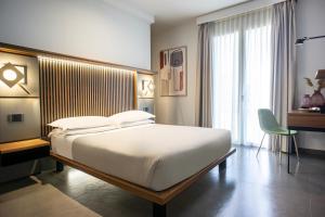 Postel nebo postele na pokoji v ubytování Hotel Vespucci + 37 fotografií