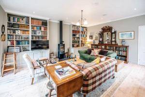 a living room with a couch and a table at 29 Wentworth Road, Aldeburgh in Aldeburgh