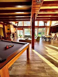 a room with a pool table in a house at Chalet Acacia au calme 1h30 de Paris in La Selle-en-Hermoy +42 photos