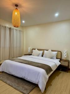 מיטה או מיטות בחדר ב-L’Oasis Nanai