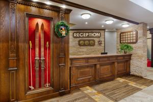 a room with a lobby with surfboards on the wall at MPM Hotel Sport Ski-in, Ski-out in Bansko +49 photos