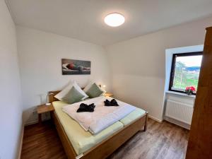 Postel nebo postele na pokoji v ubytování Aparthotel Tannenhof