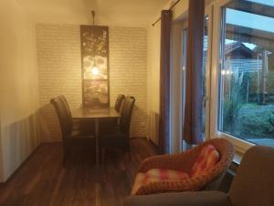 a dining room with a table and chairs and a window at Gästehaus Freren in Freren