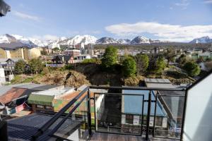 a view of the mountains from the balcony of a house at Gente del Sur - Cinco Hermanos in Ushuaia
