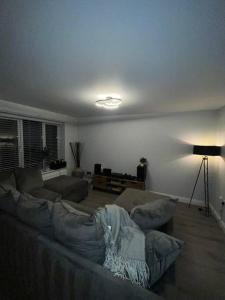 a living room with a couch and a table at Aycliffe Home Away From Home A1 in Newton Aycliffe