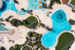 an overhead view of a swimming pool with a resort at City of Dreams Mediterranean - Integrated Resort, Casino & Entertainment in Limassol