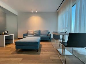 a living room with a couch and a table at Life Hotel in Bergamo