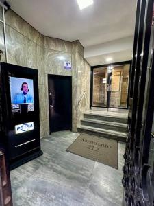 a building with a tv on the side of a door at Penthouse en Buenos Aires in Buenos Aires