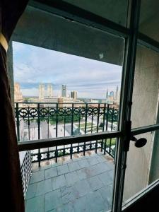 a view of a city skyline from a window at Penthouse en Buenos Aires in Buenos Aires