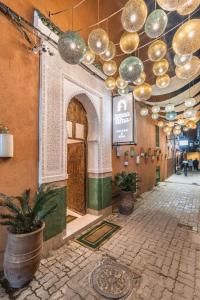 a hallway in a building with a bunch of lights at JEMAA EL FNA Suites & Spa in Marrakesh
