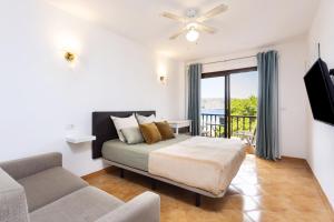 A bed or beds in a room at Seafront studio with beach view in the center of Los Cristianos