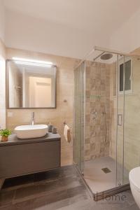 a bathroom with a glass shower and a sink at Villa Paradiso - Breathtaking Seaview in Iraion +27 photos