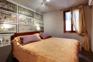 a bedroom with a large bed with two pillows at ca dei zoti3 with luggage room in Venice