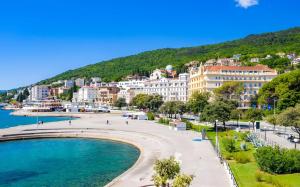 a view of a city and a body of water at Apartment FERIA 2 in Opatija