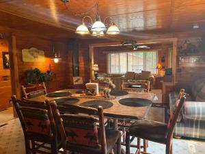 a dining room with a table and chairs at Black Moose Lodge 