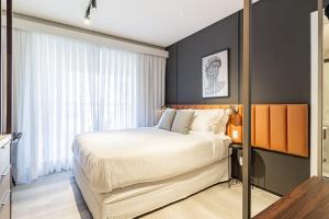 Iconyc Charlie Ibirapuera Hotel客房内的一张或多张床位