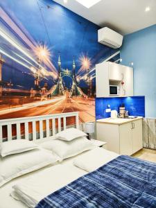 a bedroom with a painting of a bridge at King Apartment in Budapest