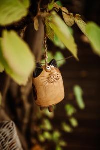a cat ornament hanging from a tree at Villa Knoche in Arnsberg +31 photos