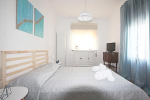 Postel nebo postele na pokoji v ubytování Apartment Jara, Tavira