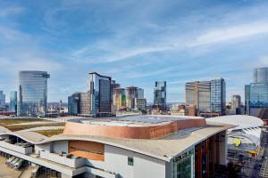 a view of a building with a city in the background at AC Hotel Nashville Downtown in Nashville