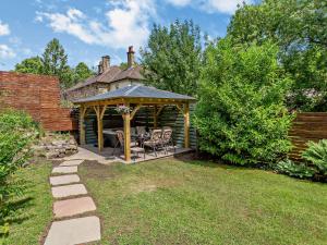 a gazebo with a table and chairs in a yard at 3 Bed in Harrogate 92158 in Harrogate