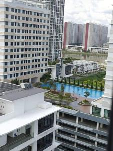 an aerial view of a city with tall buildings at 3 Bed Backpack Edusphere Suite in Cyberjaya
