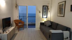 TV a/nebo společenská místnost v ubytování Apartamento mágico con vistas al mar