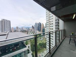 a balcony with a view of the city at KLCC Dorm (7 min walking to Twin Towers) in Kuala Lumpur